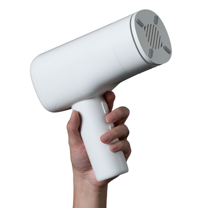 hand holding white Super Series Pro Auto-Thrusting Masturbator 