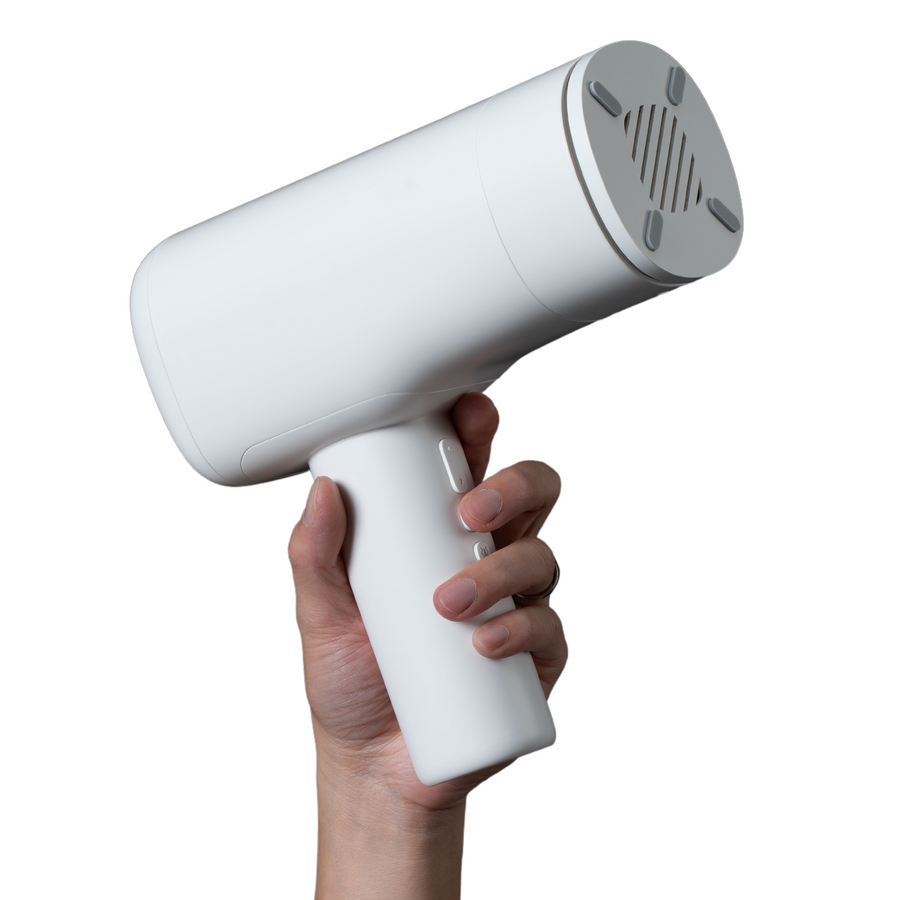 hand holding white Super Series Pro Auto-Thrusting Masturbator 