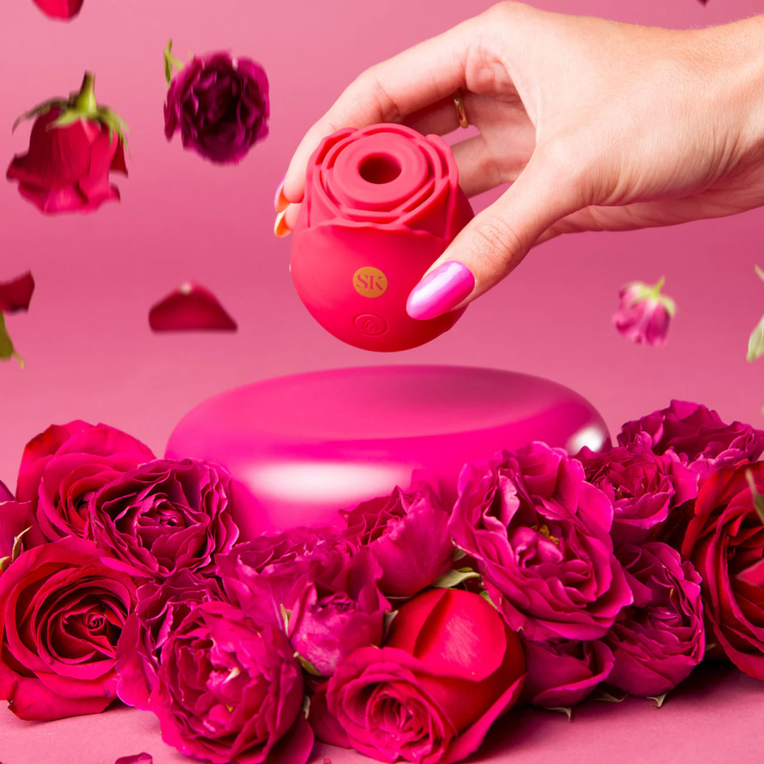 hand holding Secret Kisses Rosegasm Air Rechargeable Silicone Clitoral Stimulator 