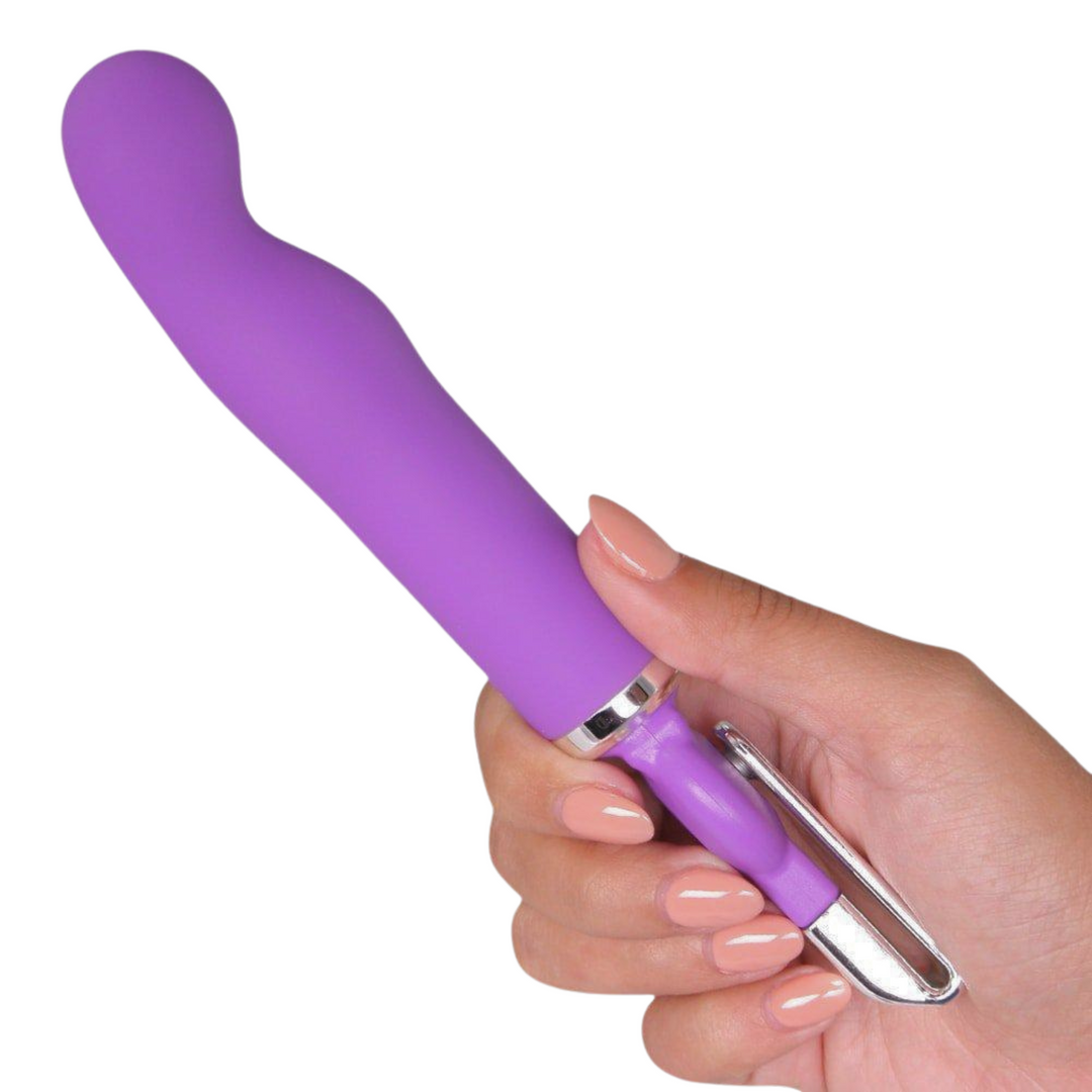 manicured hand holding Rechargeable Purple Vibrator 