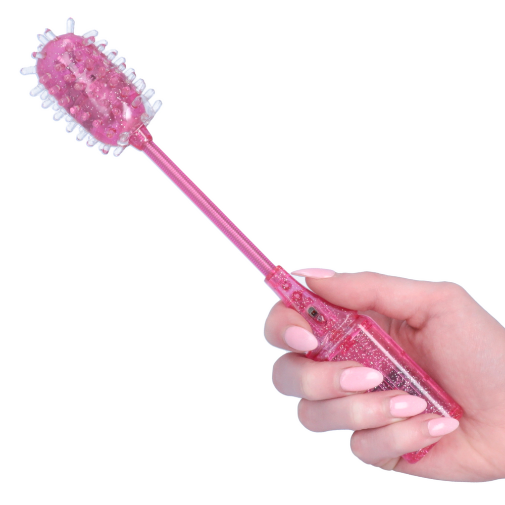 hand holding pink vibrating tickler toy 