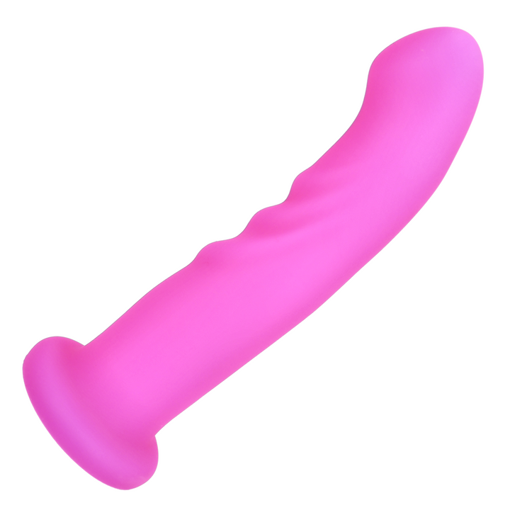 birds eye view of twirling pink g-spot dildo laying on its side 