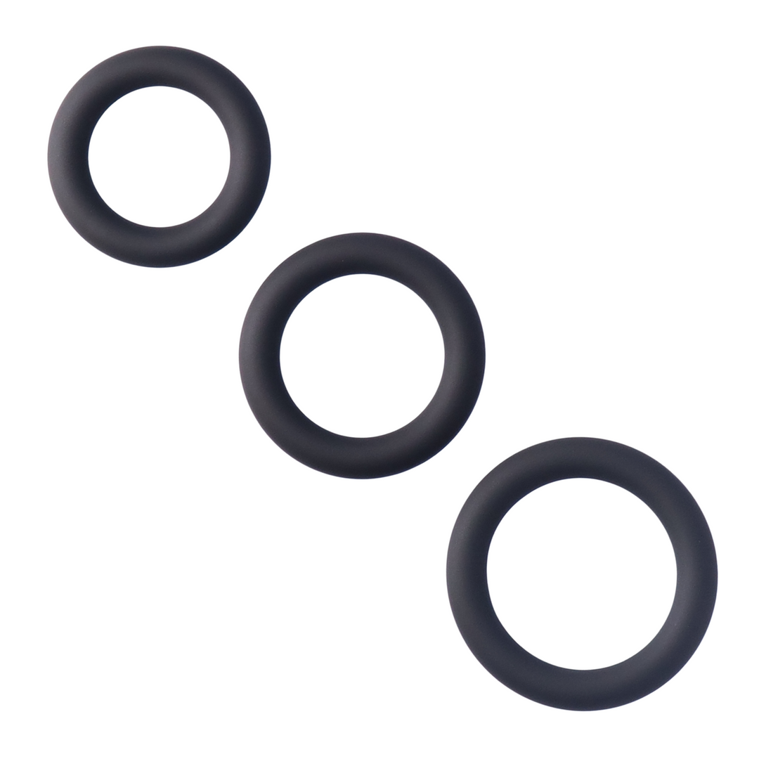Thick Silicone Tri Rings black laying in a row 