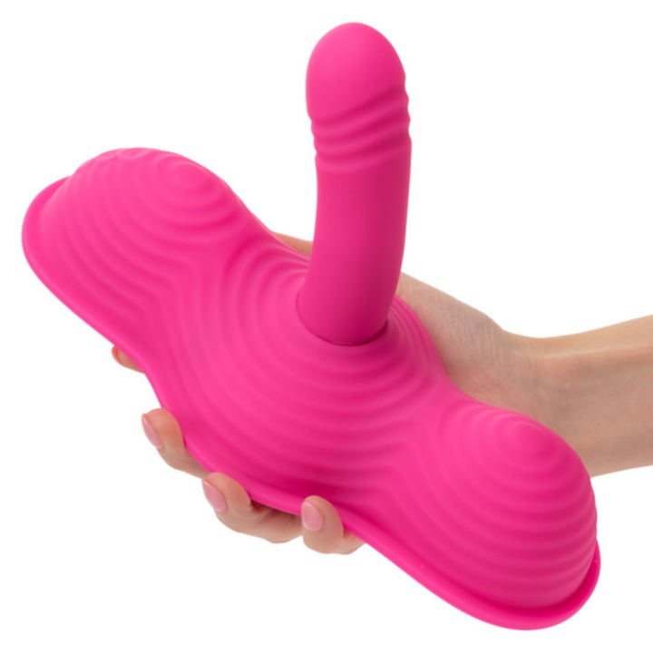 hand holding Calexotics Triple Rider Remote Control Ecstasy Rumbler Rechargeable Silicone Vibrator 