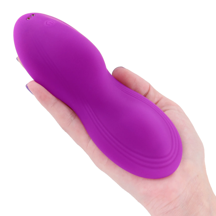 hand holding Grinders Tremor App Controlled Rechargeable Silicone Vibrating Dual Motor Pad 