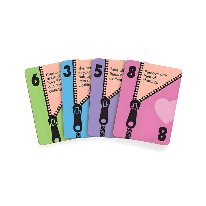 4 cards from Let's Get Naked Card Game pulled out of packaging 