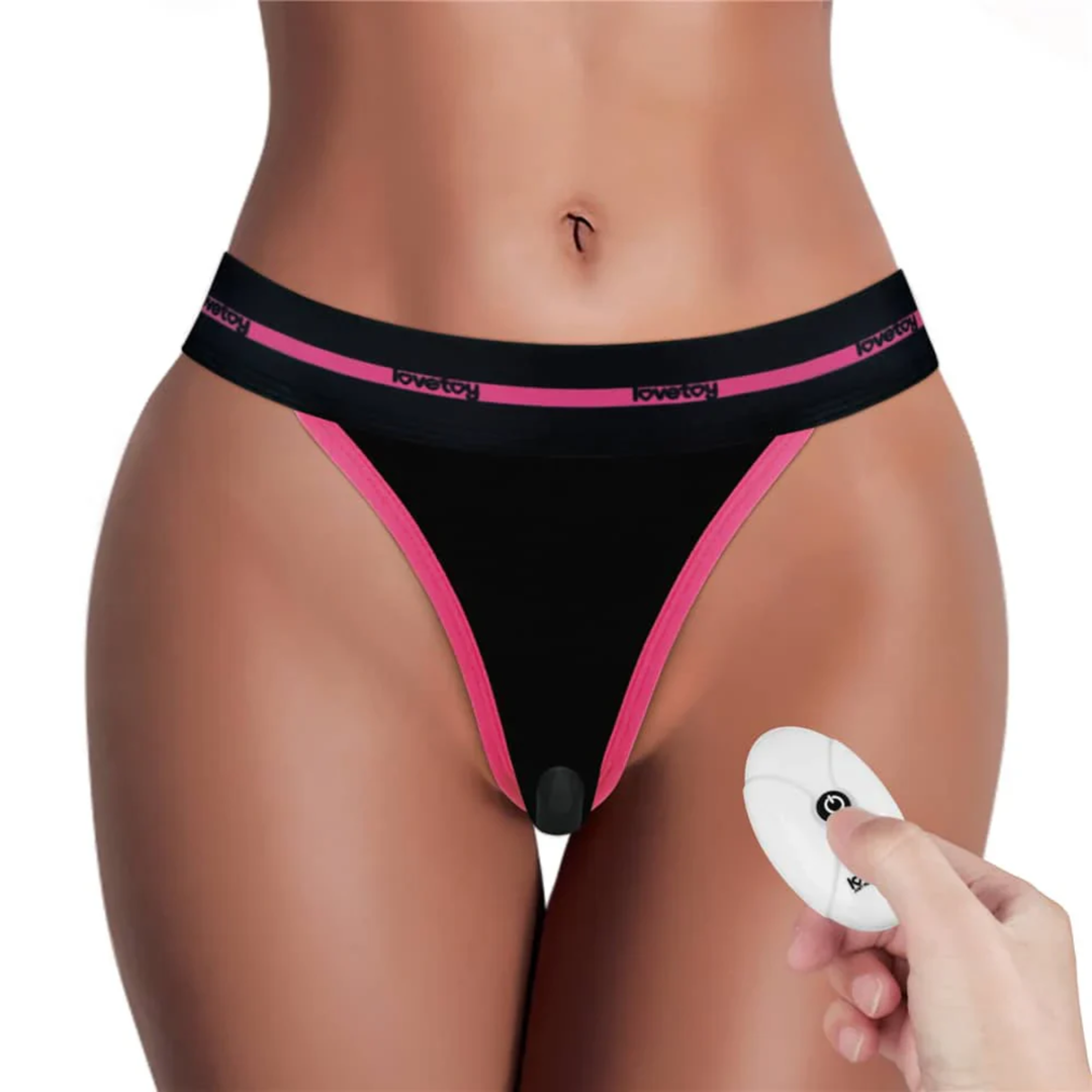 front side of INGEN Printed Slut Vibrating Sexy Panties with hand holding remote wireless 