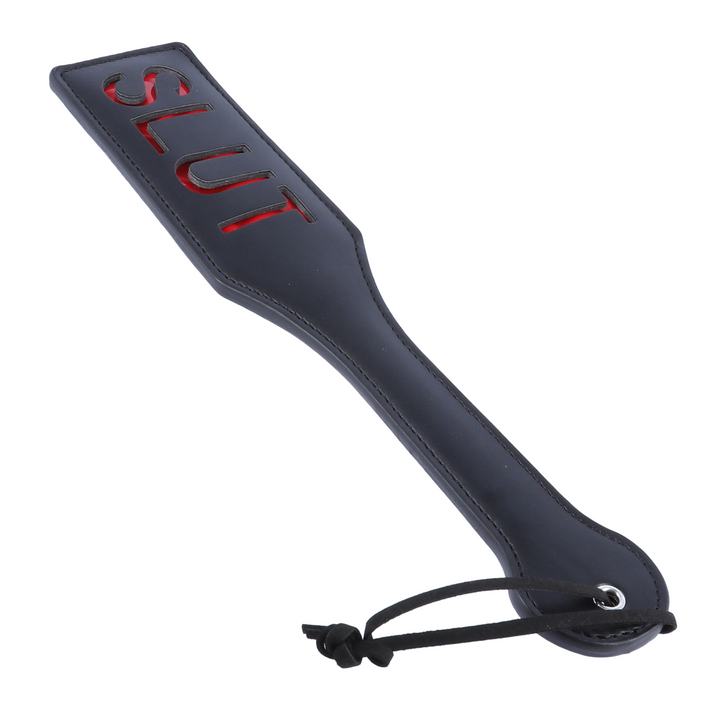 angled shot of SLUT BDSM paddle for pleasure 
