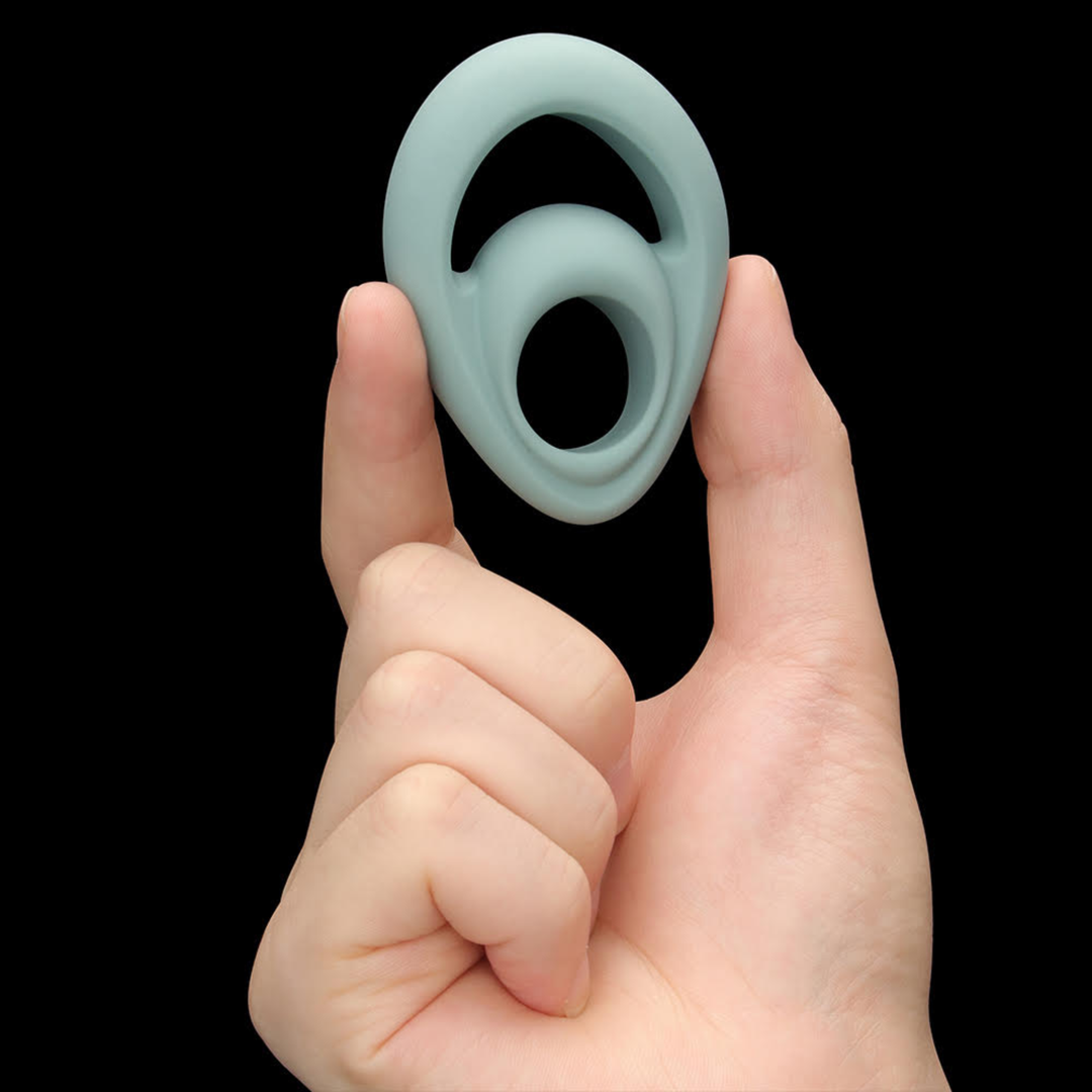 hand holding Pinnacle Pro Grip Lock Set Cock Ring