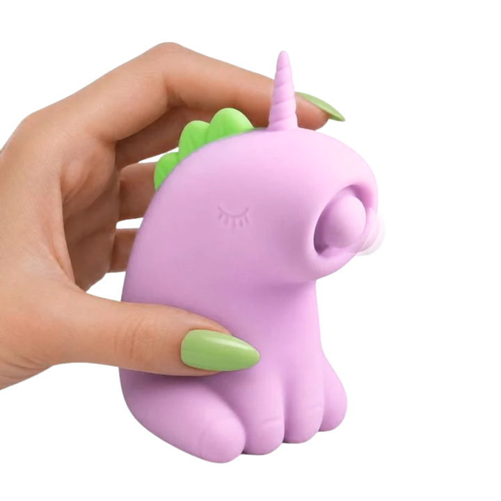 hand holding Creature Cuties Tappyhorn Tapping Rechargeable Silicone Stimulator 