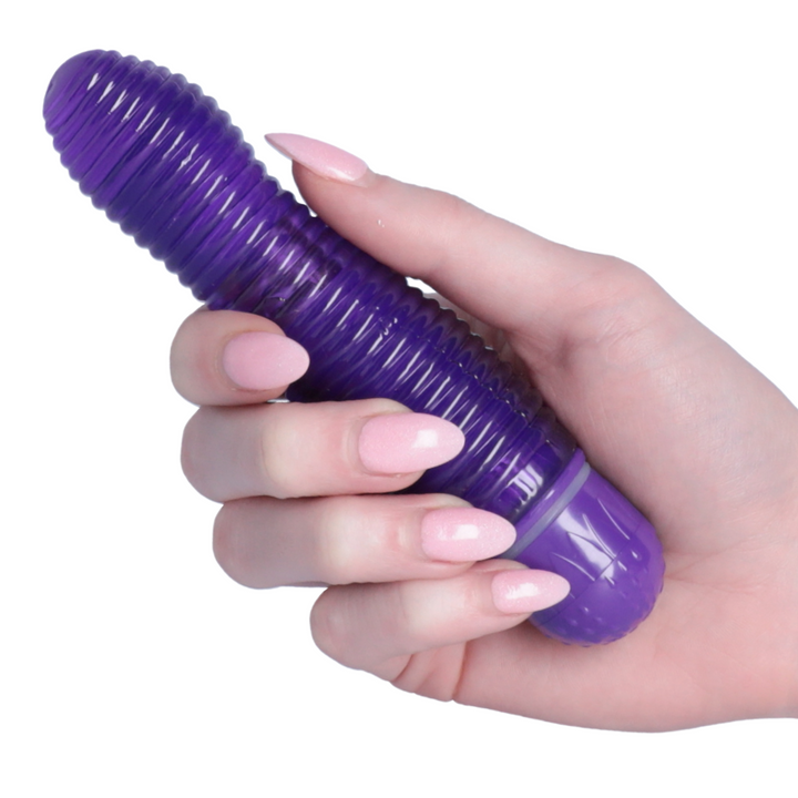 hand holding purple ribbed beehive vibrator from TopCat