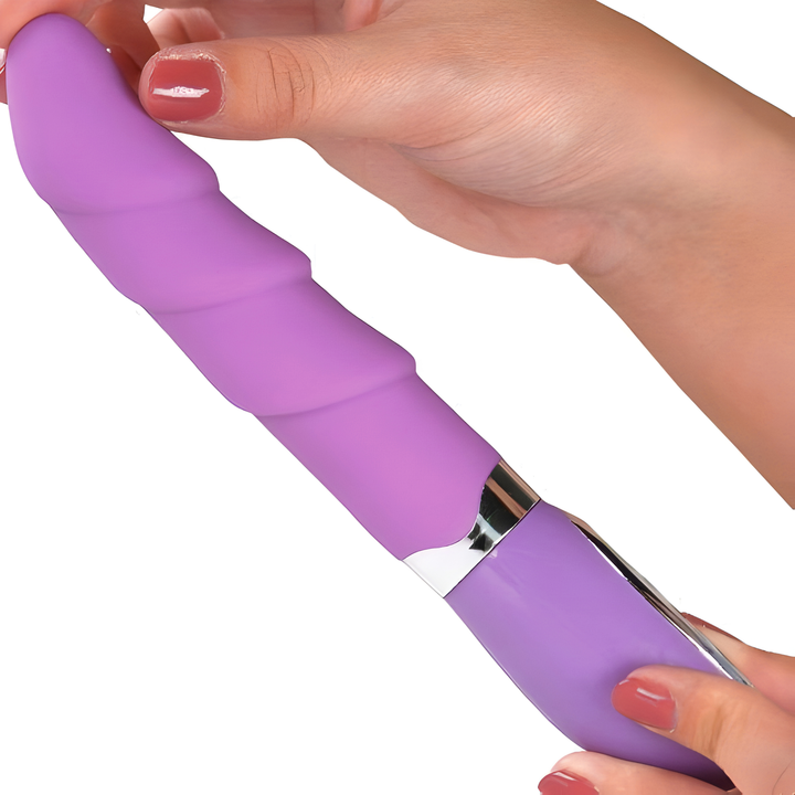 hands holding tip and base of Rippled Silicone Vibrator 