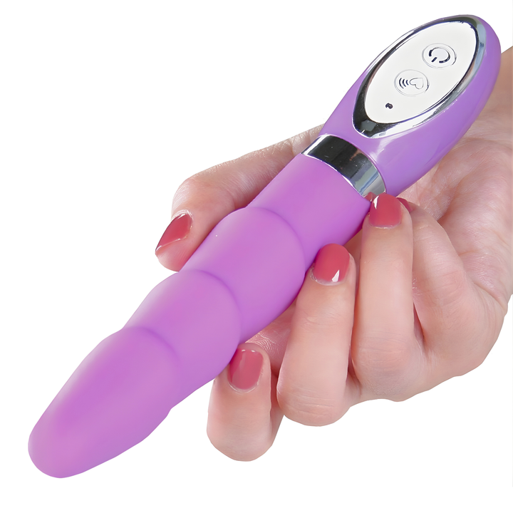 hand holding Rippled Silicone Vibrator near the base