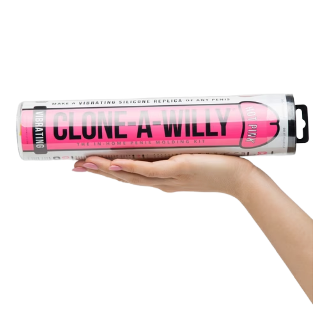 hand holding Clone-A-Willy Silicone Dildo Molding Kit with Vibrator - hot pink 