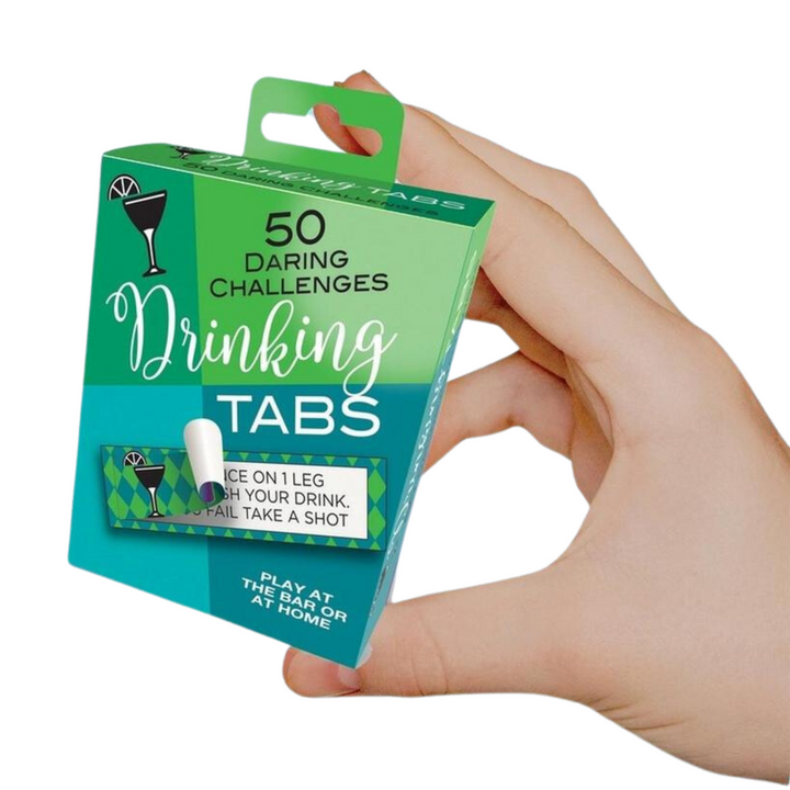 hand holding box of Drinking Tabs Drinking Game
