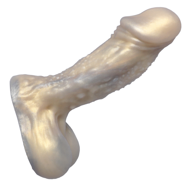 angled side view of golden alien dildo with bulbous head 