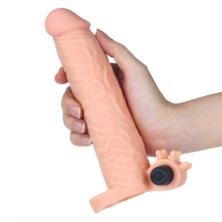 hand holding Vibrating 2 inch Penis Extension for scale color beige  