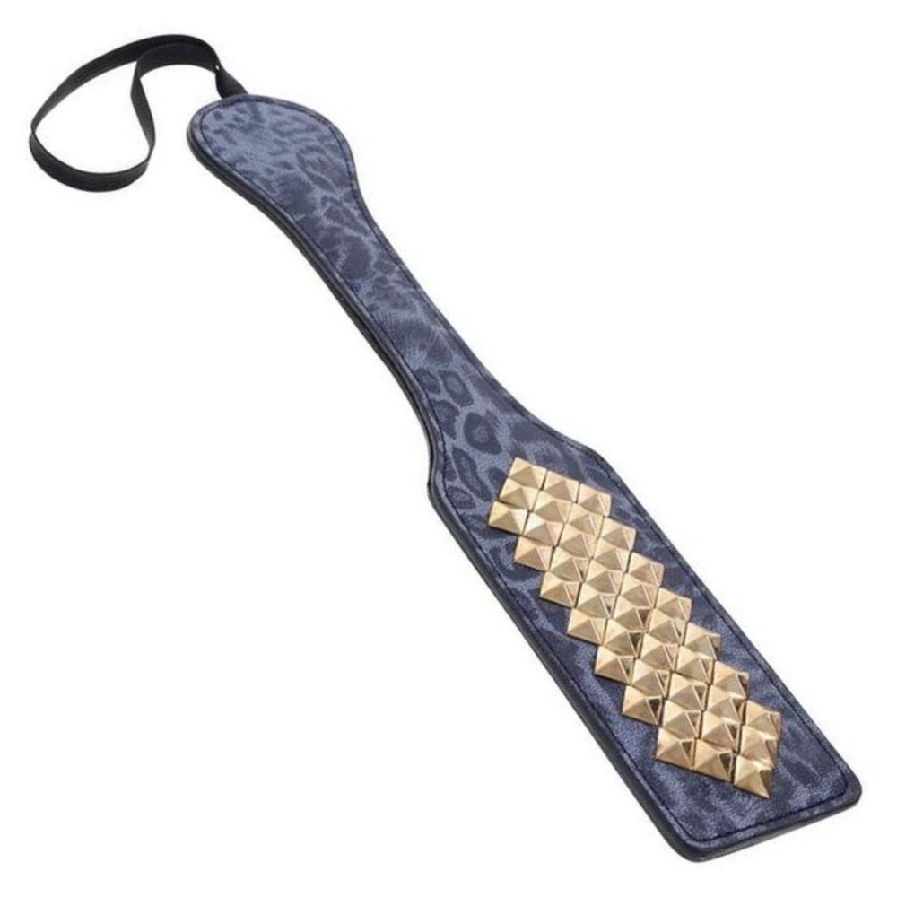 angled view of gold studs from sex and mischief kinky paddle 