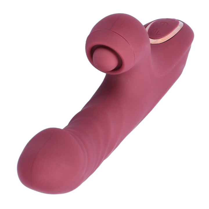 view of tip, pinpoint clitoral tapper, and control buttons from red thrusting rabbit vibrator 