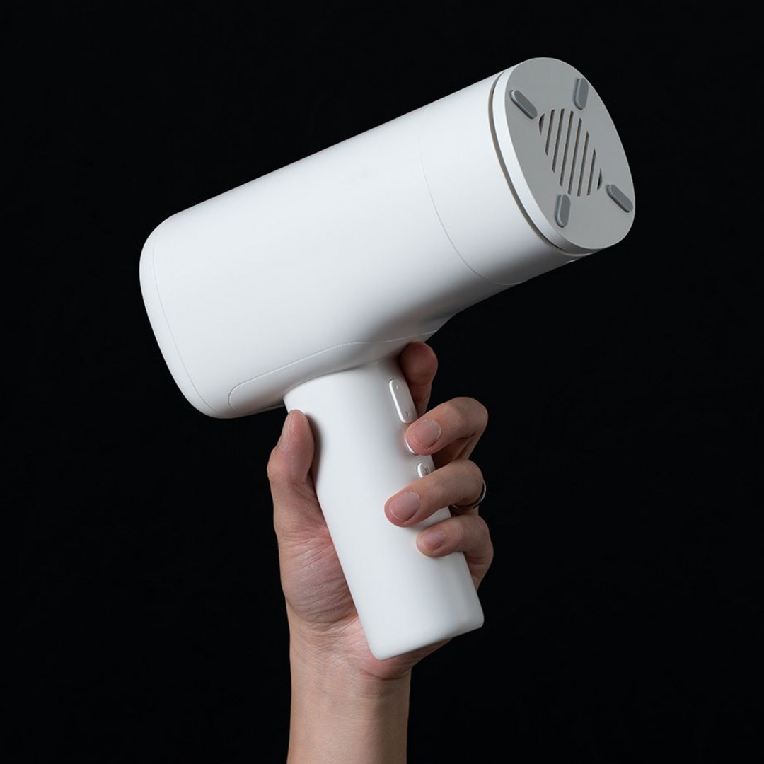man hand holding white thrusting machine