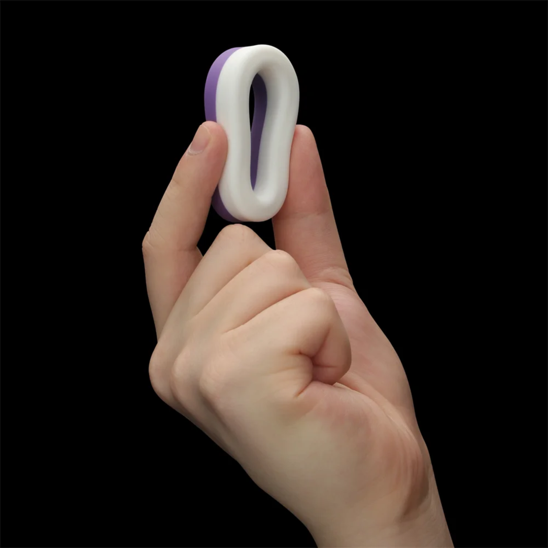 hand squeezing cock ring from Pinnacle Pro Flex Duo Cock Ring