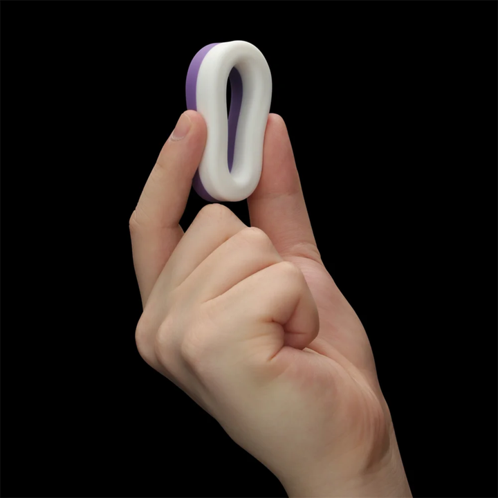 hand squeezing cock ring from Pinnacle Pro Flex Duo Cock Ring