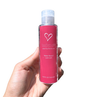 TooTimid 4.4 fl oz water-based lubricant held in hand