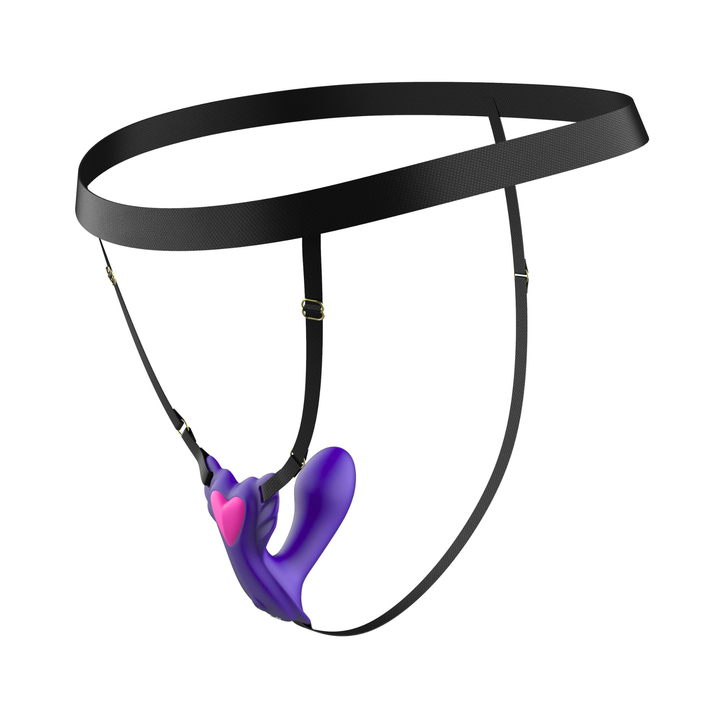angled side view of Wearable G-Spot Vibrator attached to harness 