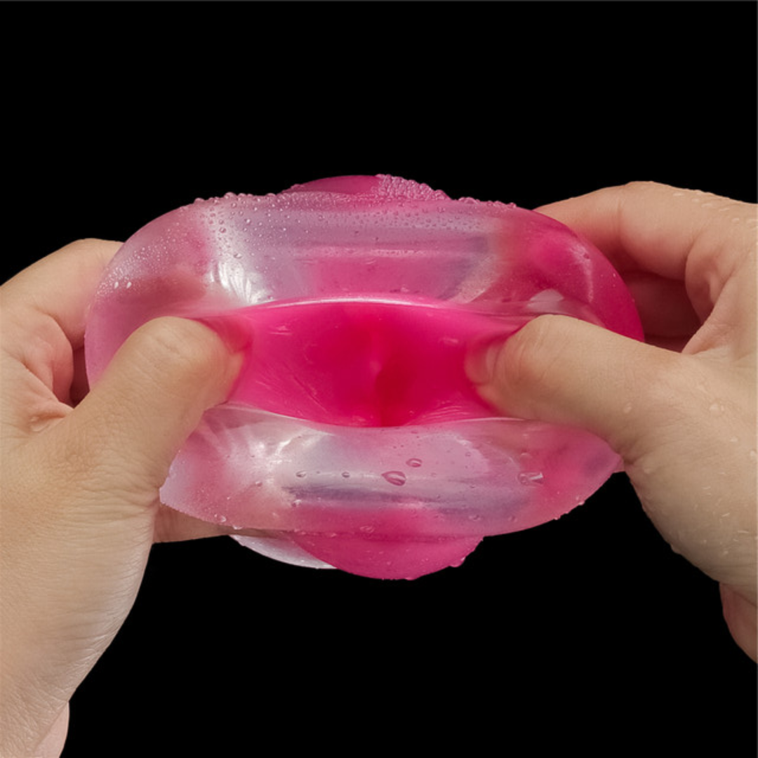 hands spreading Lumino Play Male Masturbator opening to show pink inside 