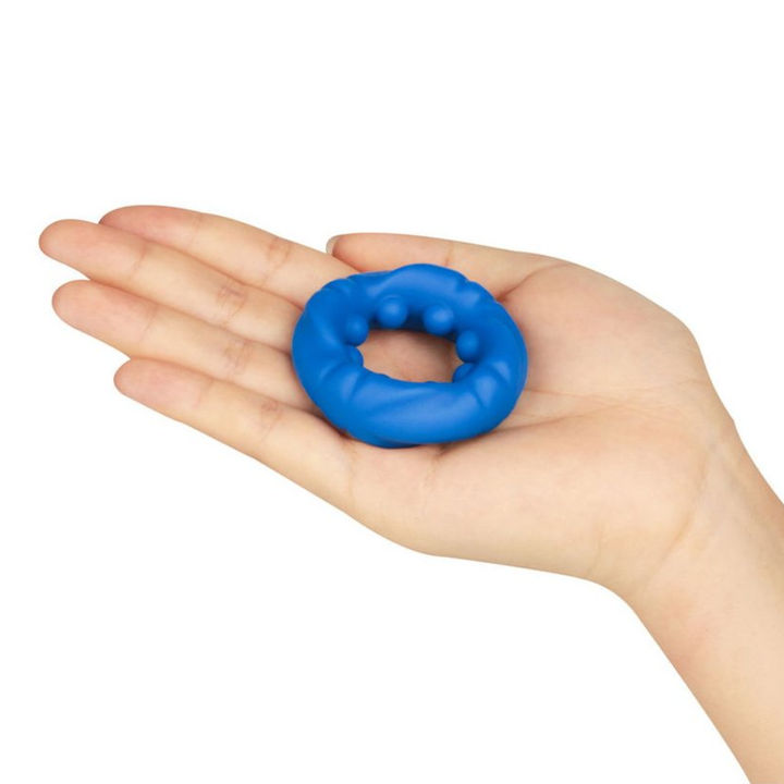 hand holding Pinnacle Pro Ridge Bump Stretcher flat in palm 