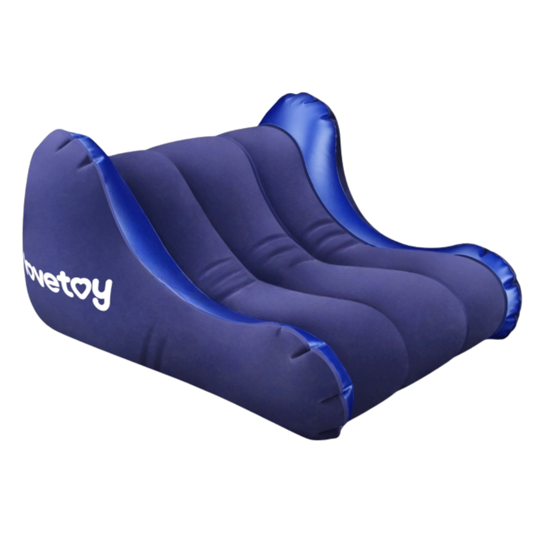 angled side view of Rebellion Reign Inflatable Positioning Cushion with lovetoy on the side 