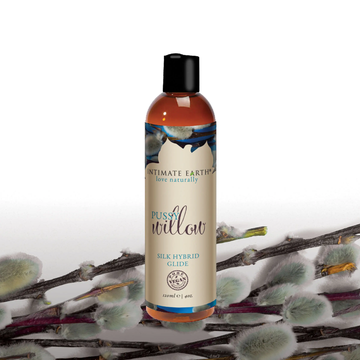 Intimate Earth Pussy Willow Silk Hybrid Glide Lubricant with pussy willow in the background 
