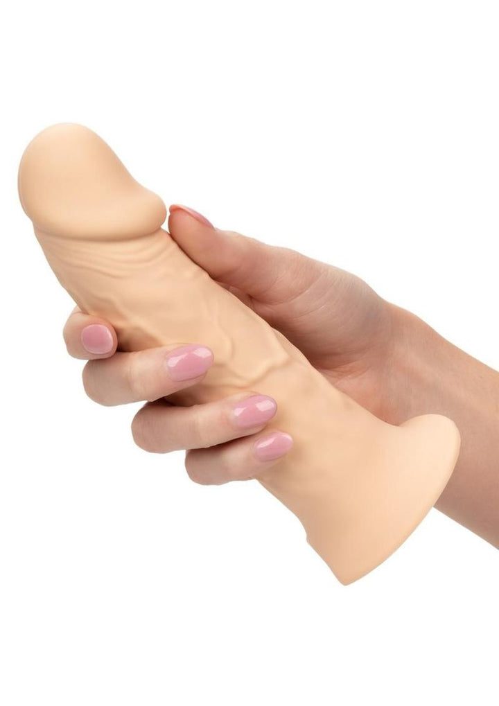 hand holding beige Performance Maxx Life-Like Extension with Harness