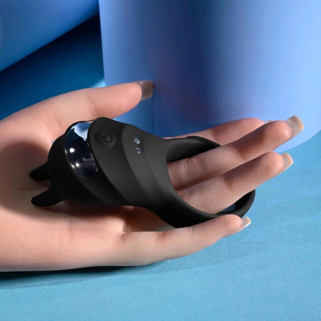 hand holding Adjustable Vibrating Couple's Cock Ring 