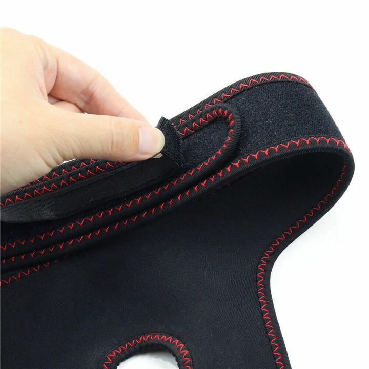 hand pulling velcro strap from Easy Strap-on Harness