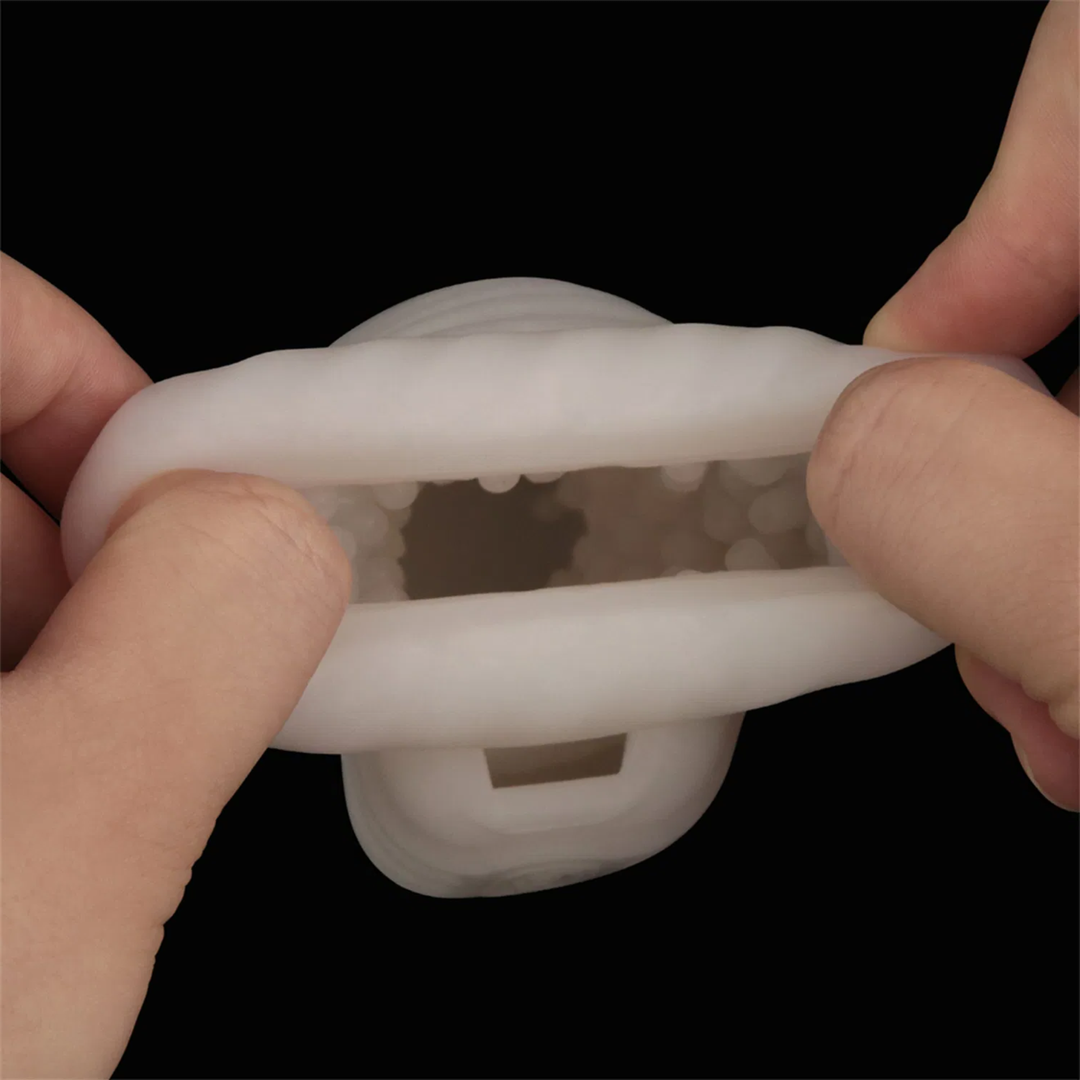 hands pulling Knights Ring Vibrating Dual Purpose Sleeve-Wavy to show pleasure nubs 