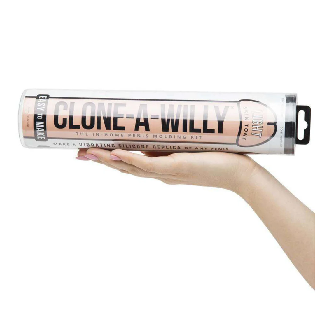 womans hand holding beige Clone-A-Willy Silicone Dildo Molding Kit with Vibrator 