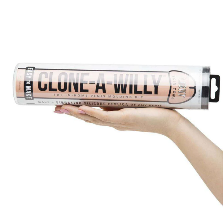 womans hand holding beige Clone-A-Willy Silicone Dildo Molding Kit with Vibrator 