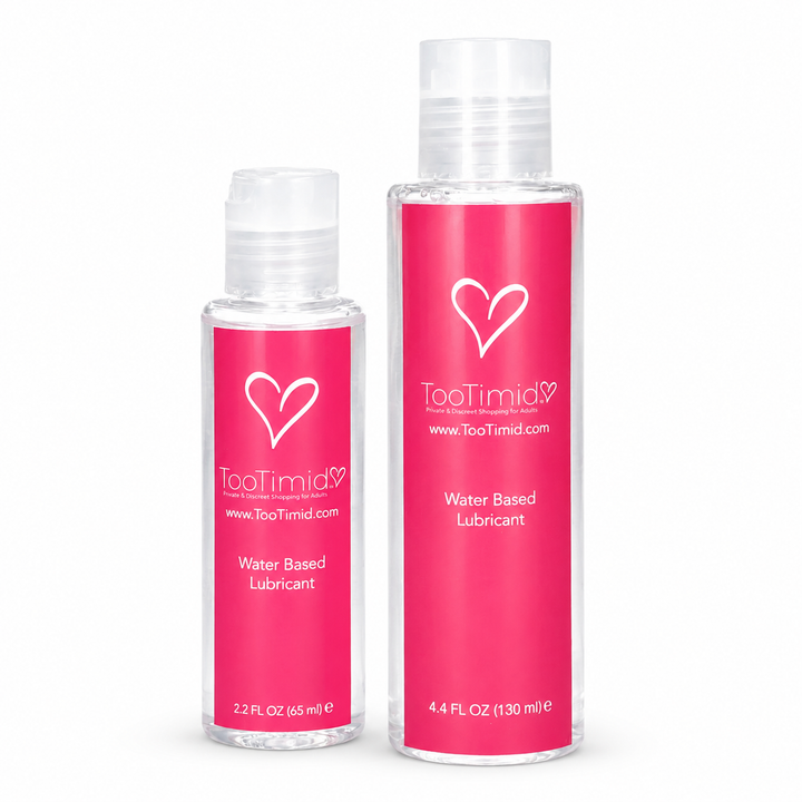 Two clear plastic bottles of TooTimid Water Based Lubricant with bright pink labels, one 2.2 fl oz and one 4.4 oz.