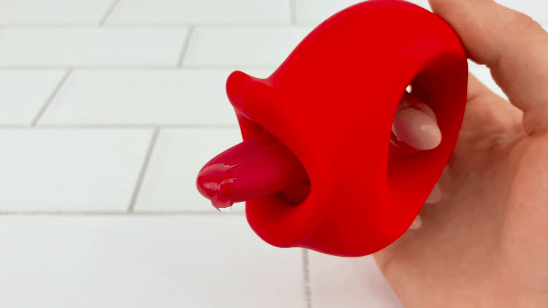 GIF of lubricant vibrating on tongue from Licking Vibrator on lower level 