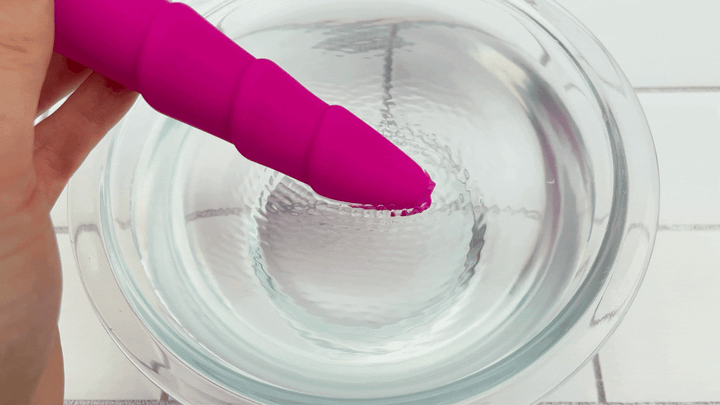 GIF of Rippled Silicone Vibrator tip vibrating in bowl of water 