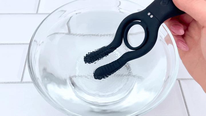 The Dual-Action Clit and Ball Vibrating Cock Ring b all stimulators vibrating in bowl of water 