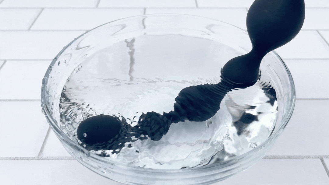 GIF of waterproof X-Long Vibrating Anal Beads vibrating in water 