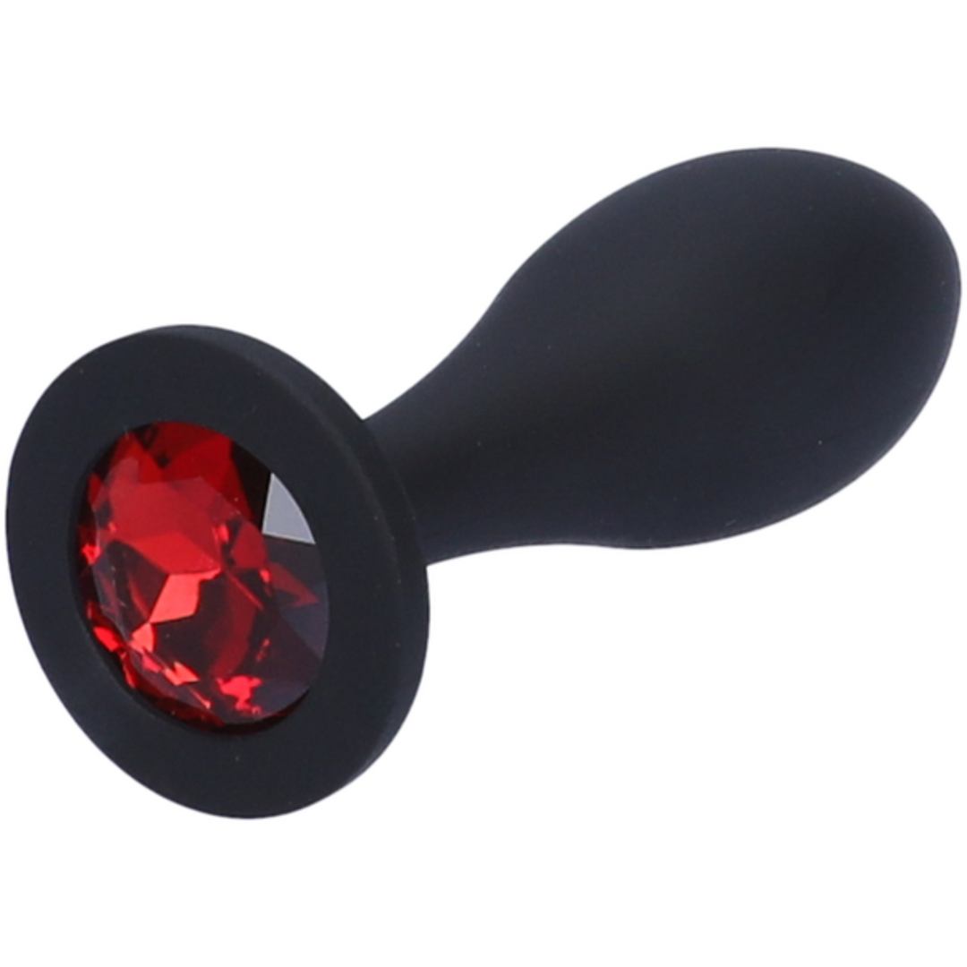 Close-up image of the red jewel at the base of the anal plug.