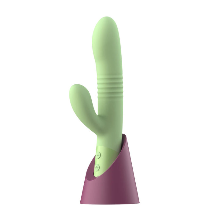 Green thrusting dildo in magnetic maroon charging base