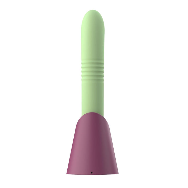 Back view of green thrusting dildo and maroon charging base with charging port visible