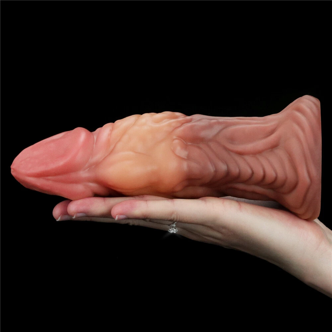 hand palm laying flat holding Dual-Density Fantasy Cock layered Platinum Silicone Plug from Lovetoy 
