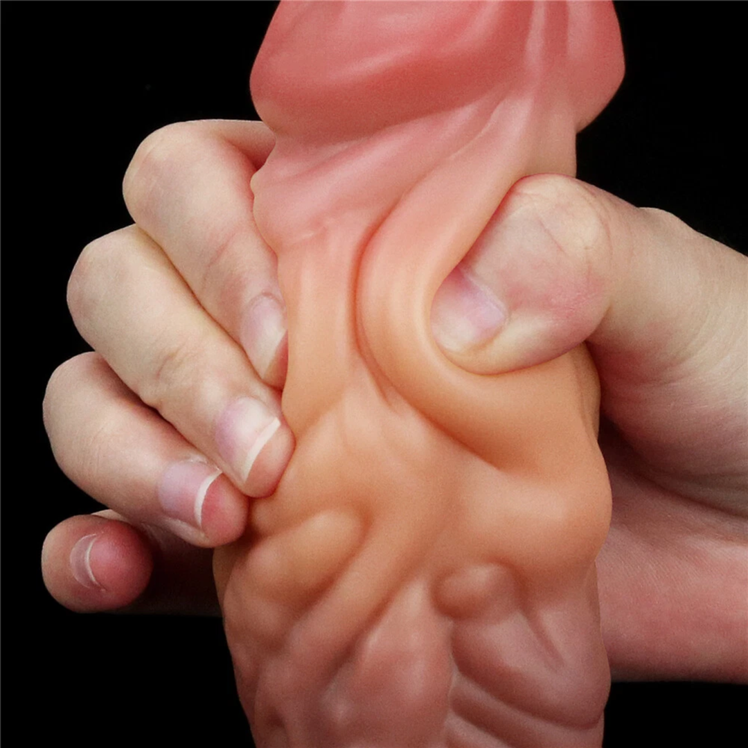hands squeezing shaft from Dual-Density Fantasy Cock layered Platinum Silicone Plug from Lovetoy 