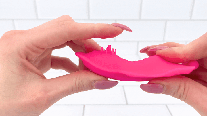 GIF of Wearable Butterfly Vibrator thumb brushing against nubbies 