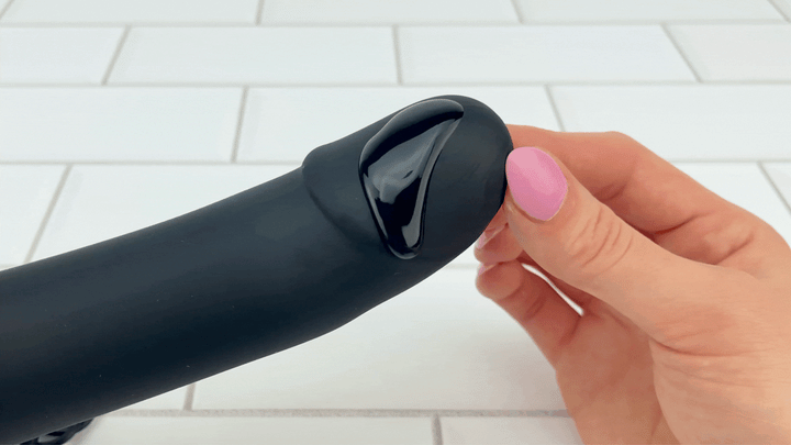 GIF of lubricant on vibrating tip of Vibrating Silicone Hollow Strap On 